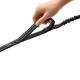 Hand hält schwarze gepolsterte Hundeleine mit reflektierenden Punkten, Bungee-Stoßdämpferabschnitt und HUNTER-Label.