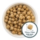 Bowl filled with small, round pet food kibble, measuring 1.1cm x 1.1cm, showcasing the average size of the pieces.