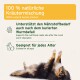100% natürliche Kräutermischung / 100% natural — unterstützt die Ernährung nach abgeheiltem Wurmbefall; dreifarbiger Hund auf dem Rücken.