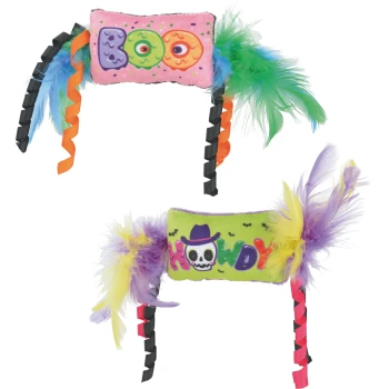 Two feathered cat toys: pink plush 'BOO' with green/blue feathers; green plush 'MEOW' with skull and purple/yellow feathers.