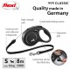 Flexi retractable dog leash, 8m cord for dogs up to 12kg, featuring ergonomic grip, comfortable braking system, and reflective components.