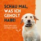 Ein glücklicher Labrador hält ein Haustierprodukt vor einem orangefarbenen Waben-Hintergrund. Text: "SCHAU MAL, WAS ICH GEHOLT HABE!"