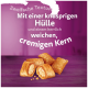 Haustierleckerlis mit einer knusprigen äußeren Schicht und einem weichen, cremigen Kern, auf einem lila Hintergrund mit Text in Deutsch.