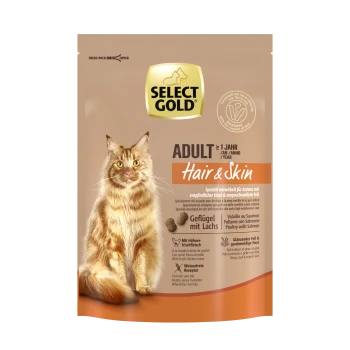 Emballage de nourriture pour chats Select Gold Adult Hair & Skin mettant en vedette un chaton roux duveteux. Les points forts du texte incluent "Geflügel mit Lachs" et "Weizenfreie Rezeptur."