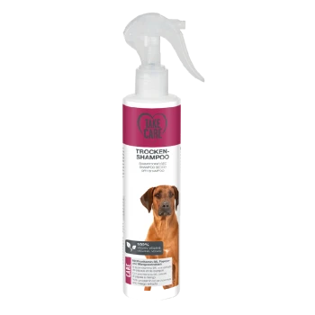 Fles droge hondenshampoo gelabeld 'Take Care', met een spuitmond, met tekst die aangeeft dat het 100% vegan is en papaja- en mango-extracten bevat.