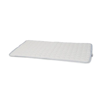 Matelas pour animaux de compagnie blanc avec une surface matelassée et des bords arrondis, conçu pour le confort et le soutien.