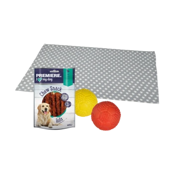 Un tapis gris à motifs d'étoiles avec des rouleaux de friandises à mâcher Premiere pour chiens et une balle en caoutchouc jaune et rouge.