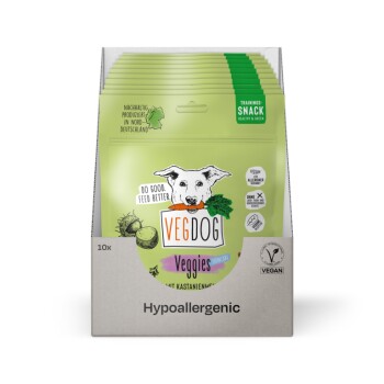 VegDog Trainingssnacks in einer grünen Box, mit einem Cartoon-Hund und Text, der gesunde, umweltfreundliche Haustierleckereien bewirbt.