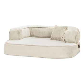 Ein plüschiges, cremefarbenes Haustierbett mit niedrigem Profil und zwei Seitenkissen, entworfen für Komfort und Entspannung.