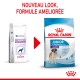 Deux sacs de nourriture pour chiens : à gauche "Pediatric Junior Giant," à droite "Royal Canin Junior." Texte au-dessus : "NOUVEAU LOOK, FORMULE AMELIORÉE."