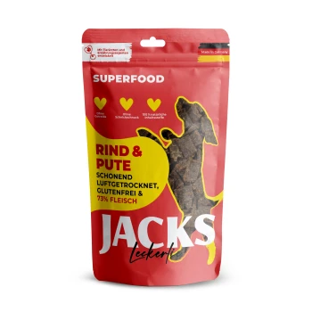 Rote Verpackung von JACKS Hundeleckerlis mit einer Silhouette eines Hundes, beschriftet mit "RIND & PUTE", glutenfrei, 73% Fleisch und in Deutschland hergestellt.