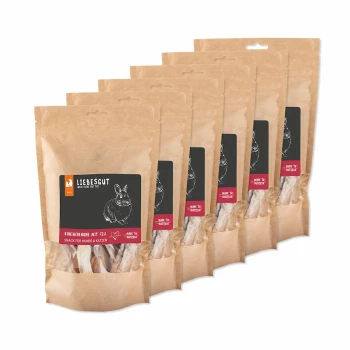 Sechs Kraftbeutel LIEBESGUT Kaninchenohr-Snacks (mit Fell), schwarzes Etikett mit Kaninchen-Skizze und „Snack für Hunde & Katzen“.
