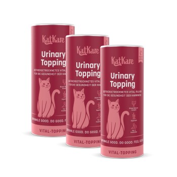 Drei rosa KatKare 'Urinary Topping'-Dosen als Katzennahrungsergänzung mit Katzenillustration und sichtbarem 'Urinary Topping'-Text.