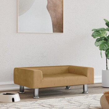 Beiges modernes Haustiersofa mit Metallbeinen neben einer weißen Futterschale und einer grünen Pflanze in einem weißen Topf.