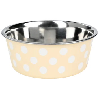 Un bol de nourriture pour animaux beige avec des pois blancs et un intérieur en acier inoxydable brillant.