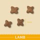 Four star-shaped dog kibble pieces in brown color, labeled "LAMB," with a size reference of 14 mm on a light yellow background.
