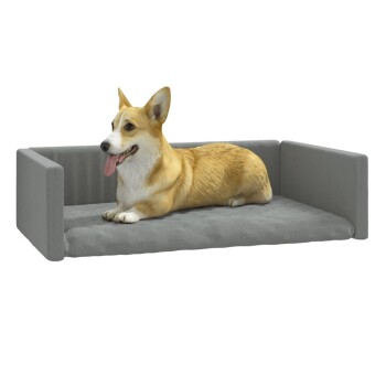 Ein entspannter Corgi liegt auf einem grauen Haustierbett mit erhöhten Seiten und zeigt ein komfortables Design für kleine Hunde.