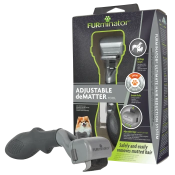 FURminator 'Adjustable deMATTER Tool' in der Verpackung mit grauer Entfilzungsbürste; sichtbarer Text 'ADJUSTABLE deMATTER TOOL'