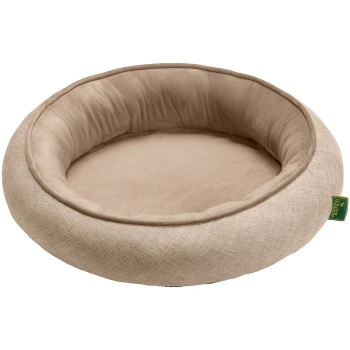 Orthopädischer Hunde- und Katzenschlafplatz Seattle beige S Ein rundes, plüschiges Haustierbett in hellbeige mit einem weichen, gepolsterten Innenraum und einem strukturierten Außenstoff.