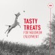 A jumping dog reaching for a ball, with the text "TASTY TREATS FOR MAXIMUM ENJOYMENT" in bold red letters.