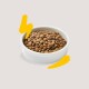 A white bowl filled with brown pet food kibble, surrounded by yellow graphic accents on a light background.