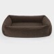 Braunes, plüschiges Haustierbett mit erhöhten Rändern, entworfen für Komfort und Unterstützung, vor einem weißen Hintergrund.