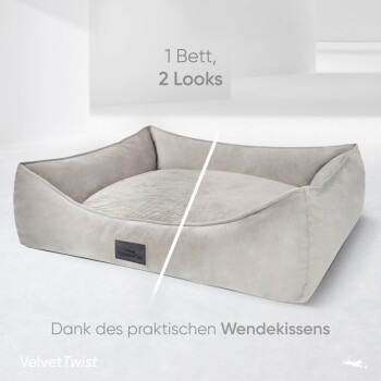 Haustierbett mit zwei Stilen, mit einem weichen, plüschigen Design und einem abnehmbaren Kissen. Der Text lautet "1 Bett, 2 Looks" und "Dank des praktischen Wendekissens."