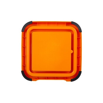 Helle orangefarbene Lickimat mit einer strukturierten Oberfläche und schwarzen Gummirändern, entworfen für die Fütterung und Bereicherung von Haustieren.