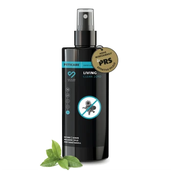 Schwarze Sprühflasche des Peticare Living Clean 2010 antibakteriellen Haustier-Oberflächenreinigers mit deutschem Etikett und grünen Blättern.