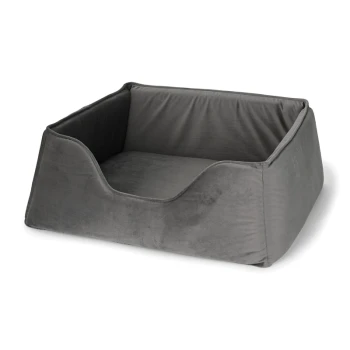 Graues Haustierbett aus weichem, plüschigem Stoff mit niedrigen Seiten für einfachen Zugang, entworfen für Komfort und Entspannung.