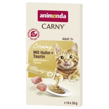 Pudełko karmy Animonda CARNY: 'Creamy Mit Huhn + Taurin / With Chicken + Taurine', pomarańczowy pręgowany kot liżący się, wylewający się kremowy pasztet.