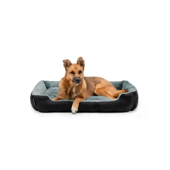 Hundebett mit Wendekissen grau/ schwarz XL Ein entspannter Hund, der auf einem plüschigen, grau-schwarzen Haustierbett liegt, das Komfort und Stil zeigt.