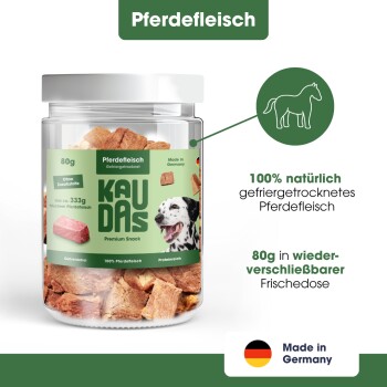 Das Bild zeigt eine Hand, die einen Hundesnack hält, mit dem Text: "100% Pferd," "0g," "Ohne Zucker oder Zusatzstoffe," und "Ideal für Training & Belohnung."