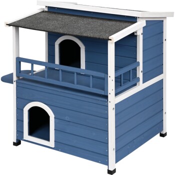 Blue wooden pet house with a slanted roof, two entryways, and a small balcony. Ideal for small pets.