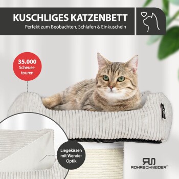 Beiges Cordstoff-Katzenbett mit herausnehmbarem Kissen neben einer Waschmaschine; sichtbarer Text ‚MASCHINENWASCHBAR‘ und ‚30 °C waschbar‘.