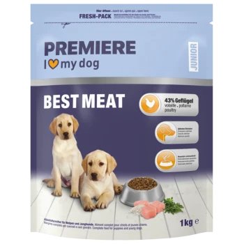 Premiere I love my dog Junior Best Meat Welpenfutter mit 43 % Geflügel, zwei Labrador-Welpen, Futternapf mit Kroketten und Fleischstücken auf Holzboden.