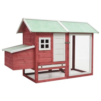 Rotes Holzhaustierhaus mit grünem Dach, mit einem kleinen Fenster, einer Tür und einem Netzgehege für Haustiere.