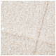 Close-up van een zachte, fluffy witte huisdierdeken met een textuur van krullend oppervlak.
