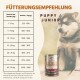 Deutsche Fütterungstabelle „Fütterungsempfehlung“ für „PUPPY / JUNIOR“, Husky‑Welpe neben einer Wildfang „Pferd Pur“-Dose.
