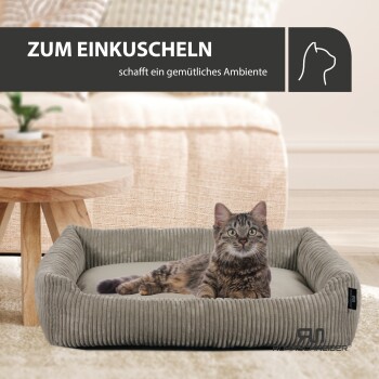 Ein gemütliches Katzenbett mit einer getigerten Katze, die darin liegt, begleitet von dem Text 'ZUM EINKUSCHELN' und 'schafft ein gemütliches Ambiente.'