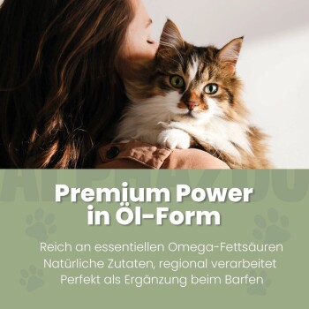 Katze ruht auf der Schulter einer Person mit dem Text „Premium Power in Öl-Form“ und Produktvorteilen auf Deutsch darunter.