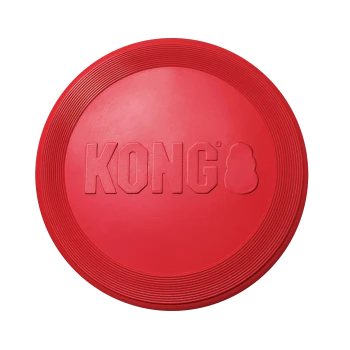 Frisbee pour chien KONG en caoutchouc rouge avec logo 'KONG' embossé et bord concentrique rainuré sur fond blanc.