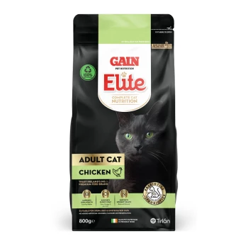 Black cat with green eyes on a bag of Gain Elite cat food, labeled "Adult Cat Chicken," 800g, highlighting nutritional benefits.