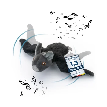 Interaktives plüschiges Fledermausspielzeug mit Musiknoten, mit einem Etikett, das "1,3 SEHR GUT" und "Prüfengel"-Zertifizierung trägt.