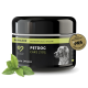 Schwarzes und grünes Glas von Petcare Petdog Care 2103 Balsam für die Pfotenpflege, mit einer Hundesilhouette und einem Blatt daneben.