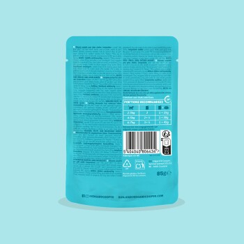 Dos d'un sachet de nourriture pour animaux turquoise avec tableau de rations, code‑barres, texte dense d'ingrédients et étiquette « 85g ».