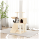 Eine flauschige grau-braune Katze sitzt auf einem beigen Katzenbaum mit mehreren Ebenen und einem gemütlichen Versteck, umgeben von natürlichem Licht.