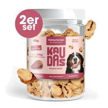 Glas mit KAU DAS Hühnerherz-Hundeleckerlis, 60g, mit einem glücklichen Hund auf dem Etikett, mit dem Text "Training & Belohnung" und "100% Fleisch."
