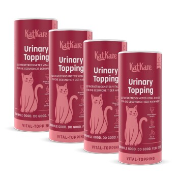Vier rosa KatKare 'Urinary Topping'-Dosen mit Katzenillustration und 'Vital-Topping'-Aufschrift.