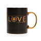 Schwarze Keramiktasse mit goldenem Griff, mit 'LOVE' in fettem Gold und einer Katzensilhouette mit einem Ahornblatt.